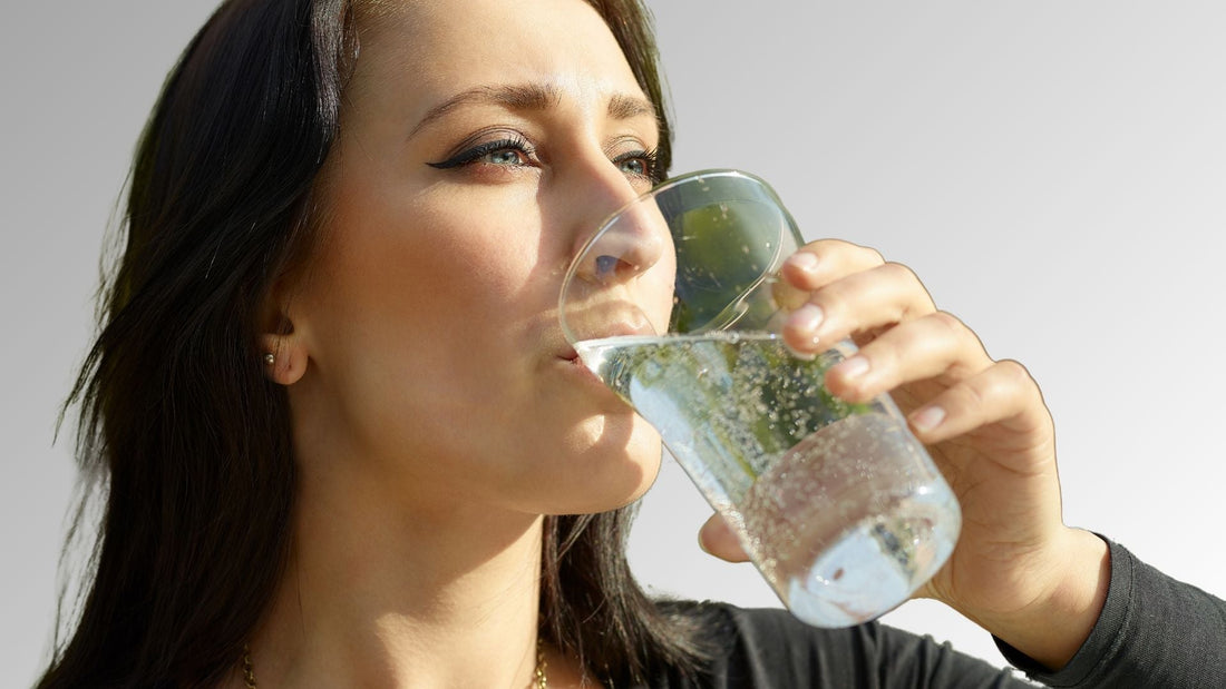 A Woman Drinking Carbonated Water