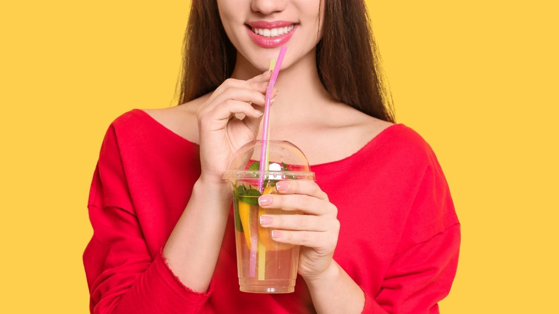 A woman drinking lemon