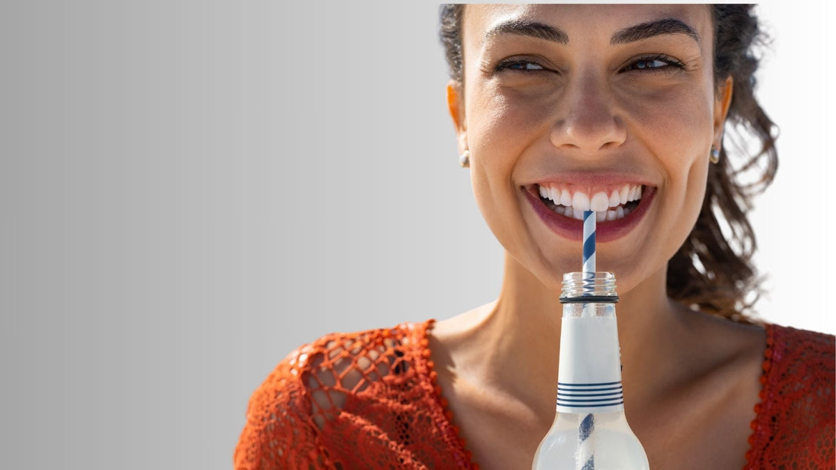 A woman drinking sprite