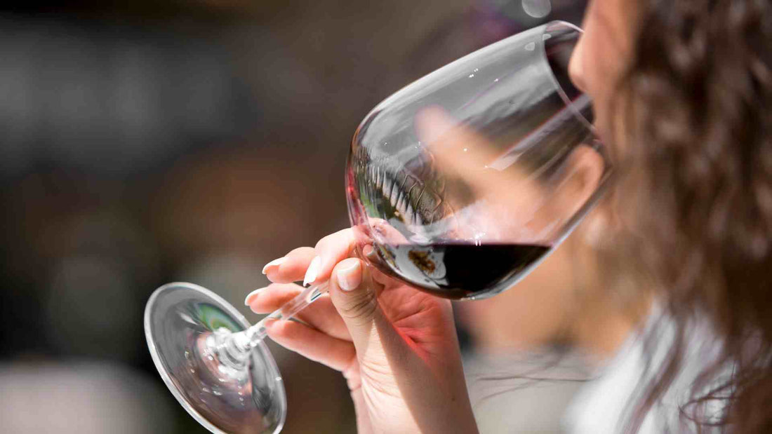 A woman drinking wine
